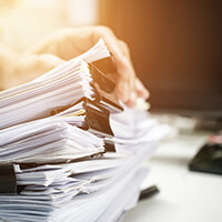 A person going over a bunch of sorted files